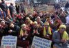 YAIKS activists holding protest in front of Raj Bhawan, Jammu on Wednesday. -Excelsior/Rakesh
