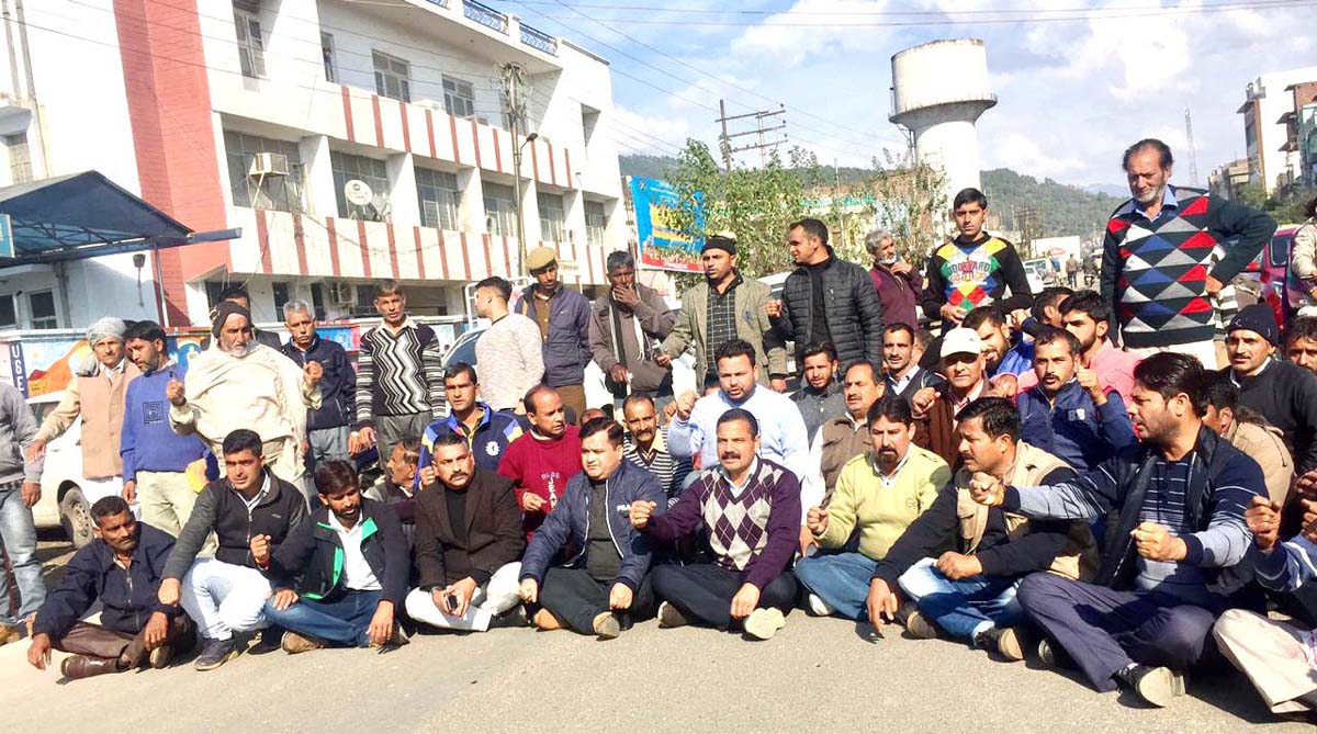 NPP activists and others staging protest outside DC office at Udhampur on Tuesday. NPP activists and others staging protest outside DC office at Udhampur on Tuesday.