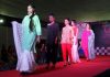 Models walking ramp to display the beauty of silk under the banner of Silk Era.
