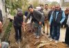 BJP leader and Corporator Baldev Singh kick starting laying of pipes in Ward 2, Gangyal.