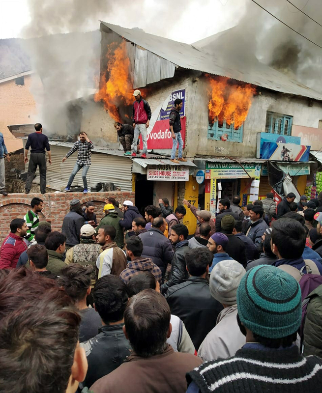 A house on fire near mini-bus stand in District Kishtwar. —Excelsior/Tilak Raj A house on fire near mini-bus stand in District Kishtwar. —Excelsior/Tilak Raj