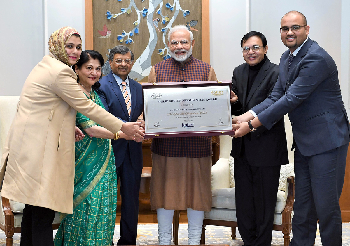 Prime Minister Narendra Modi receiving the first-ever Philip Kotler Presidential award from Professor, EMORY University, Georgia, USA Dr Jagdish N Seth in New Delhi on Saturday. (UNI) Prime Minister Narendra Modi receiving the first-ever Philip Kotler Presidential award from Professor, EMORY University, Georgia, USA Dr Jagdish N Seth in New Delhi on Saturday. (UNI)