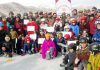 Young players posing along with dignitaries during Ice Skating Training Camp in Leh.