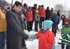 Deputy Commissioner and CEO, LAHDC, Kargil Vikas Kundal interacting with kids during Ice Hockey Camp in Kargil. — Excelsior/Basharat Ladakhi