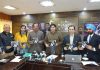 JMC Commissioner, Dy Mayor and others displaying copies of MoU, signed with ITI Ltd for Jammu Suraksha Yojna.