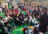 Former Minister Manohar Lal Sharma addressing a gathering during his visit in Billawar Constituency.