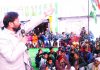 Ch Lal Singh addressing a gathering at Jammu on Monday.