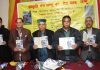 Former secretary of JKAACL, Ramesh Mehta and other dignitaries launching poetry book of Sheikh Mohammed Kalyan.