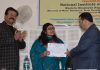 Secretary PHE Farooq Ahmad Shah distributing certificates to participants at a valedictory function of training course for engineers on Friday.