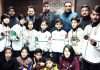Medal winners, Secretary, J&K State Sports Council Dr Naseem Chowdhary and officials of Wushu Association of J&K posing for group photograph at Jammu.