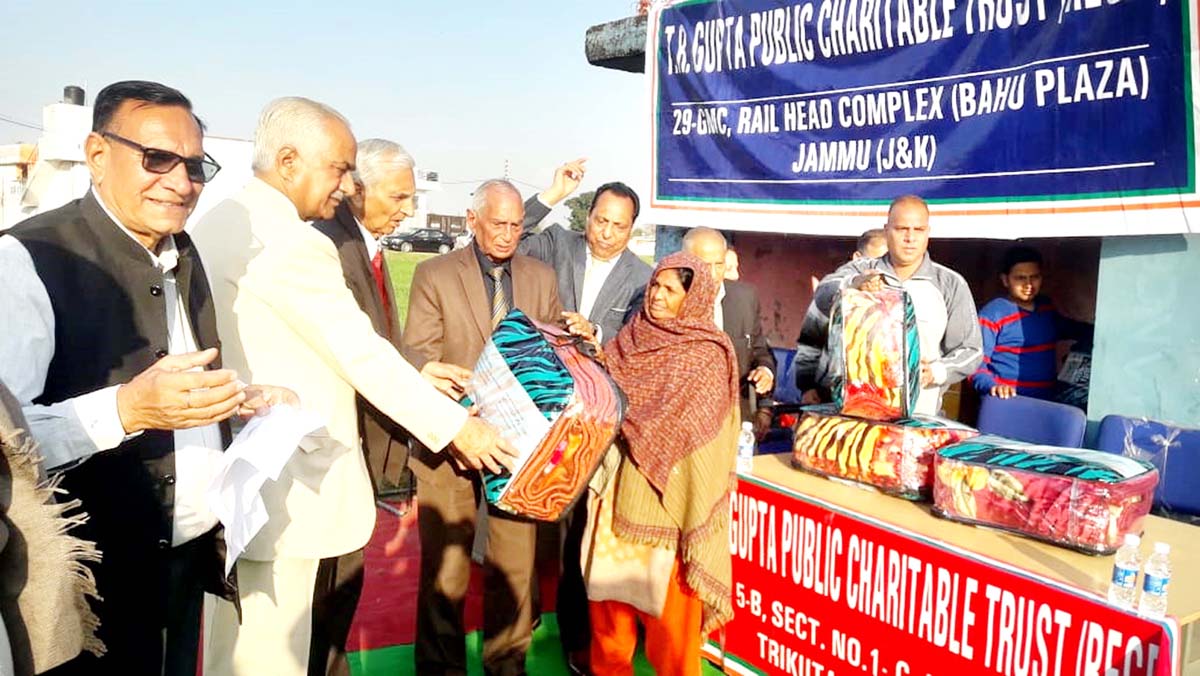 Members of TR Gupta Public Charitable Trust distributing blankets among needy. Members of TR Gupta Public Charitable Trust distributing blankets among needy.
