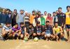 Winners posing along with officials after entering Volleyball finals.