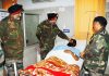 Northern Army Comdr Lt Gen. Ranbir Singh enquiring about health of an injured soldier in Base Hospital at Srinagar.