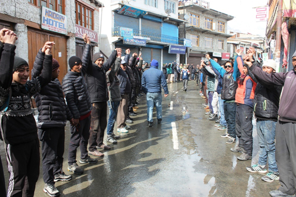 Protesters forming human chain at Kargil on Thursday. Protesters forming human chain at Kargil on Thursday.