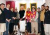 NC President Dr Farooq Abdullah posing for group photograph with new entrants in party fold on Thursday.