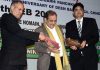 Union Minister of Steel Birender Singh felicitating Gourav Abrol Director MV Internation School in Jammu.