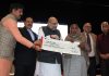 BJP national president, Amit Shah, Union Minister, Dr Jitendra Singh and MPs Jugal Kishore Sharma & Shamsher Singh Manhas and Advisor to Governor K Skandan during launch of Kissan Samman Nidhi Yogna at Jammu on Sunday. — Excelsior/Rakesh