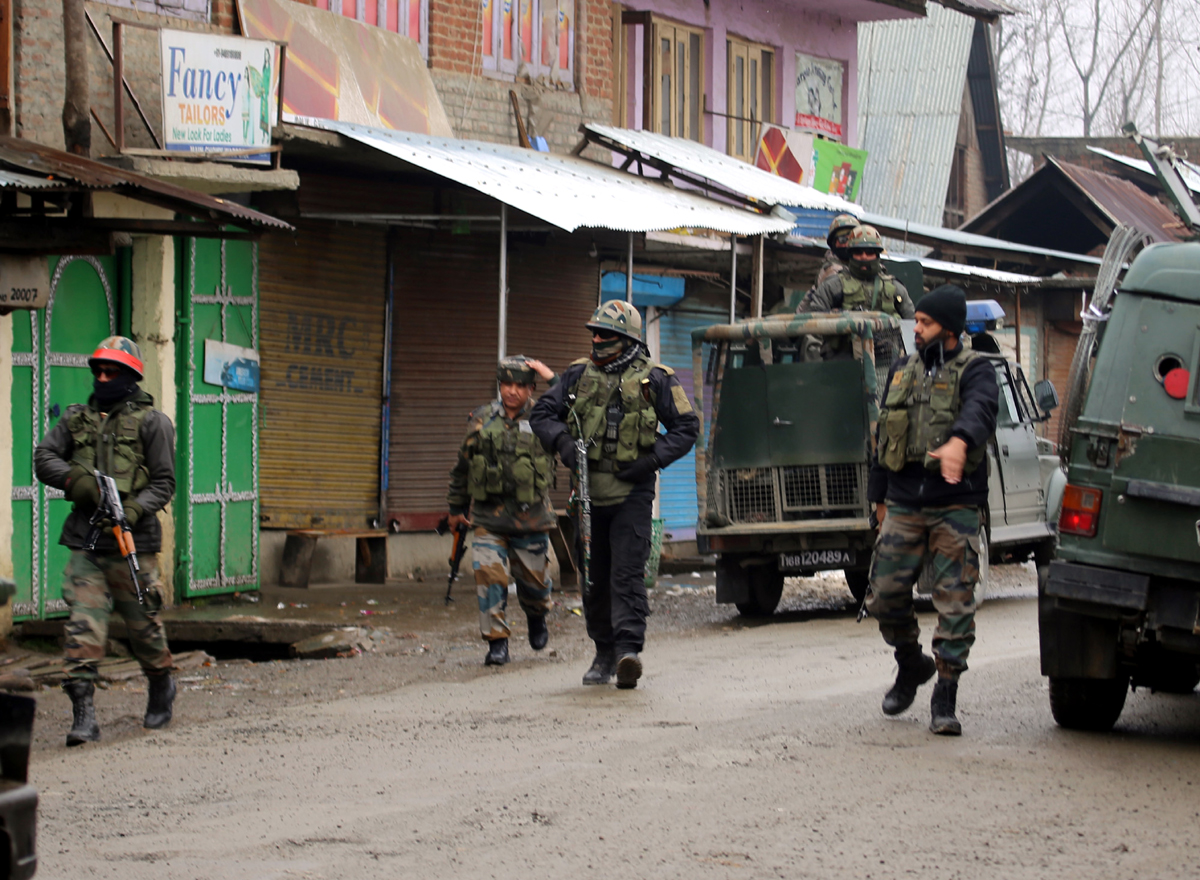 Security forces during encounter in Warpora, Sopore on Friday. Security forces during encounter in Warpora, Sopore on Friday.