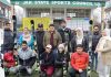 Students Skiers posing along with dignitaries during flag-off function before leaving for Russia.
