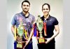 Saina Nehwal and Sourabh Verma with their trophies at the 83rd Senior National Badminton Championship in Guwahati on Saturday.