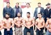 J&K Body Building team posing along with former Minister Raman Bhalla before leaving for Federation Cup.