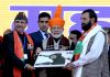 Mohammad Haneef and Lt. Gen Rakesh Sharma presenting martyr Aurangzeb’s photograph to Prime Minister Narendra Modi. — Excelsior/Rakesh