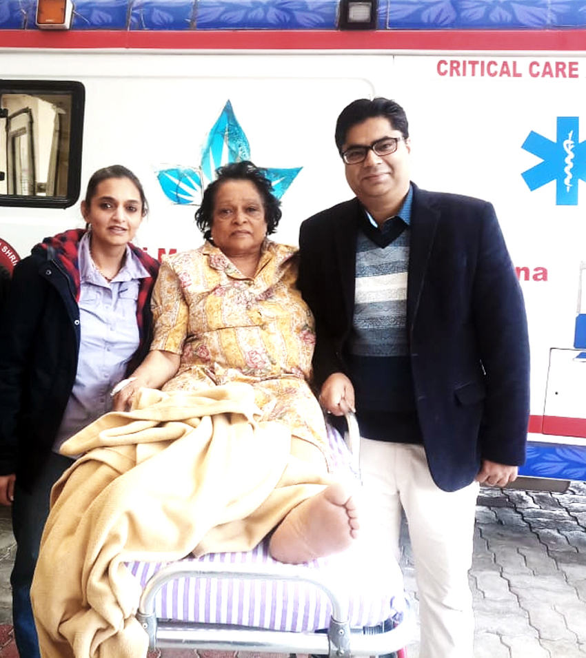 Dr Vikas Padha, Senior Consultant Orthopaedics and Joint Replacement at SMVD Narayana Hospital posing with the patient and her attendant. Dr Vikas Padha, Senior Consultant Orthopaedics and Joint Replacement at SMVD Narayana Hospital posing with the patient and her attendant.