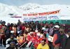 Winners of Ice Hockey Tournament posing for a group photograph along with dignitaries and officials at Kargil. -Excelsior/Basharat Ladakhi