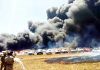 Dark smoke billows after a major fire break out at a parking area near Gate no 5 of Yehlanka airbase, more than 300 cars reportedly burnt, in Bengaluru on Saturday. (UNI)