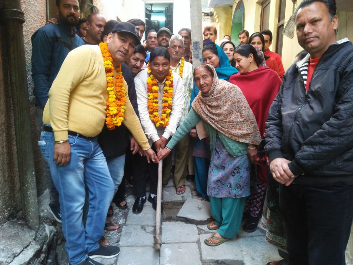 Former Minister, Sat Sharma kick-starting construction of lane and drain at Krishna Nagar on Friday. Former Minister, Sat Sharma kick-starting construction of lane and drain at Krishna Nagar on Friday.