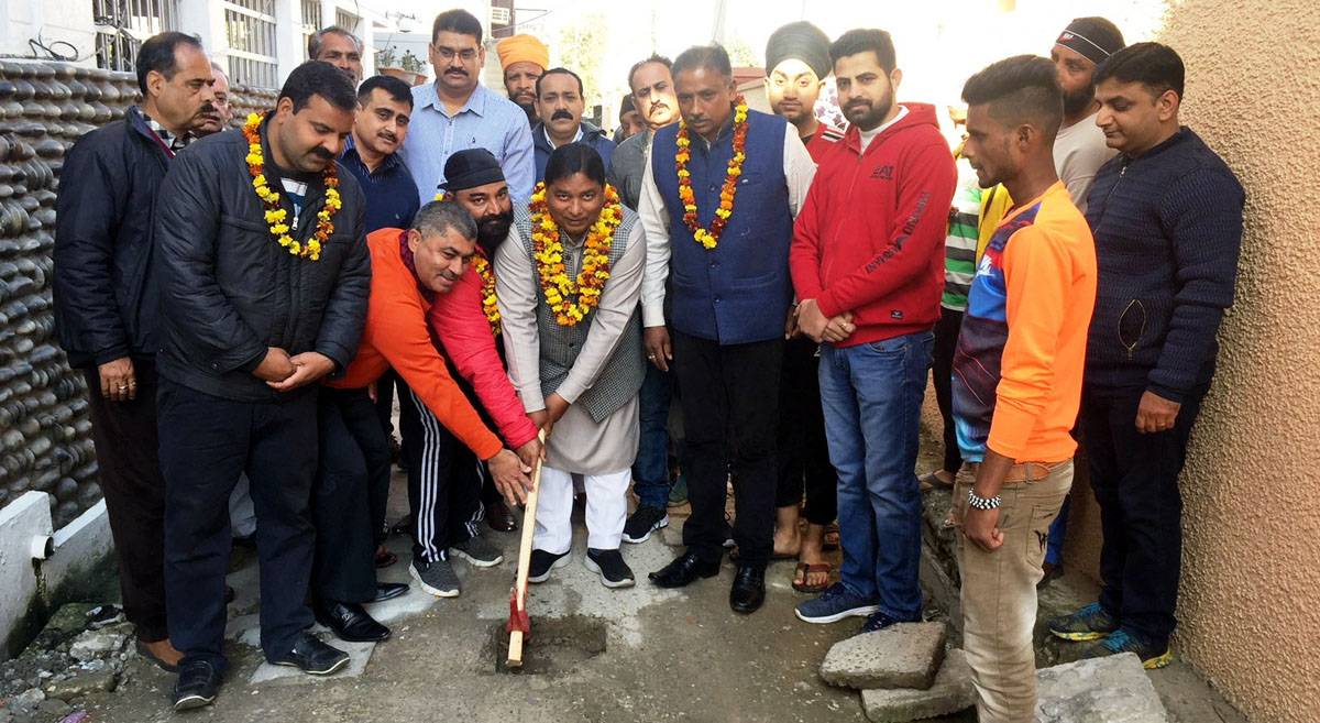 Former MLA, Sat Sharma along with others starting work on lanes and drains in Jammu on Tuesday. Former MLA, Sat Sharma along with others starting work on lanes and drains in Jammu on Tuesday.