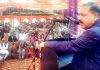 Union Minister Dr Jitendra Singh addressing public gathering after laying the foundation stone of Devika bridge, at Udhampur on Monday.