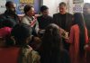 NGO ‘Healthy India Stronger India’ distributing suits and fruits to needy ladies during a programme at Jammu on Monday.