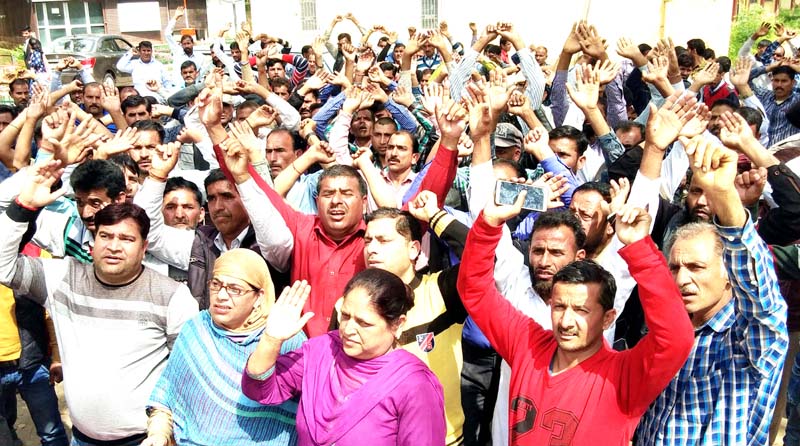 PHE workers staging protest near Press Club Jammu on Monday. -Excelsior/Rakesh PHE workers staging protest near Press Club Jammu on Monday. -Excelsior/Rakesh