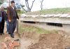 Advisor K K Sharma inspecting work on border bunker in Hiranagar on Saturday.