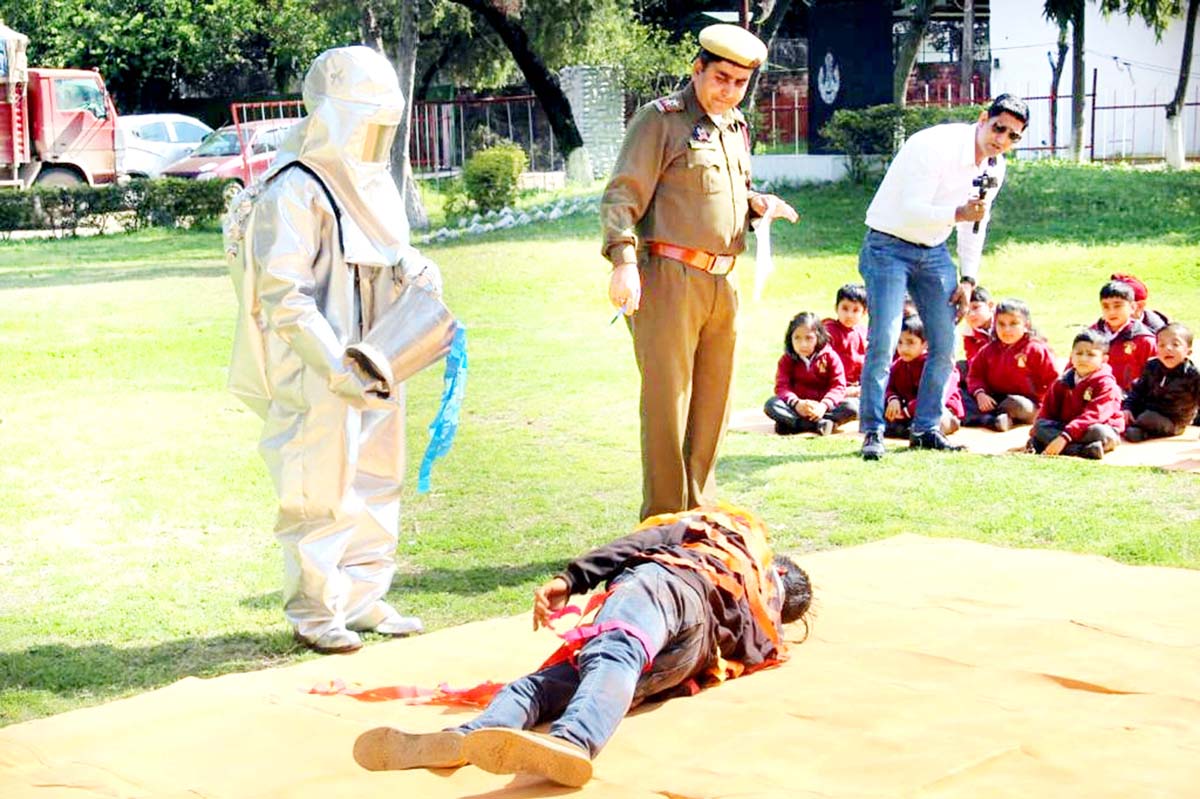 Children during fire-fighting demo. Children during fire-fighting demo.