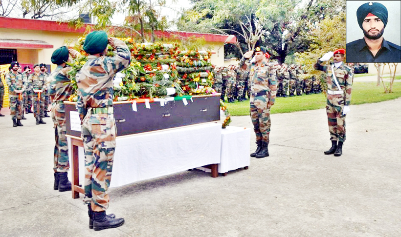 Army officials paying tributes to Karamjeet Singh on Monday.(Inset) Martyr soldier. Army officials paying tributes to Karamjeet Singh on Monday.(Inset) Martyr soldier.