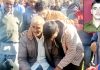 Wailing father of martyr Yash Paul (Inset) being consoled by the people.