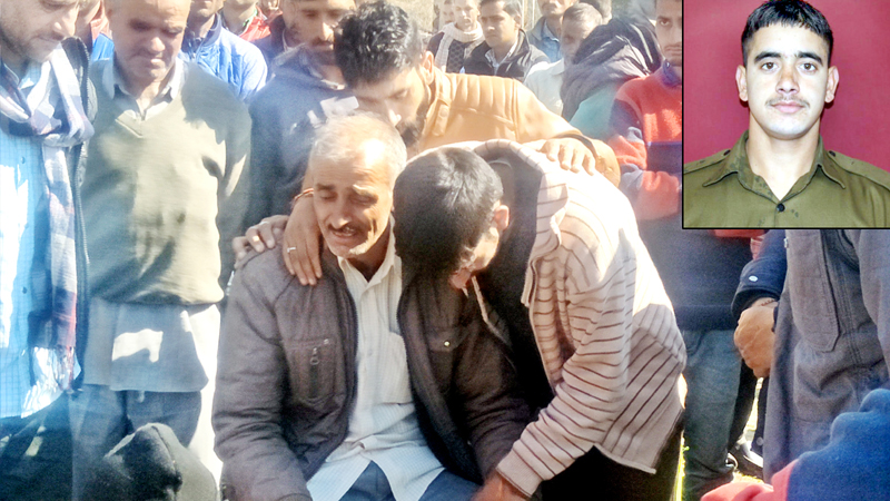 Wailing father of martyr Yash Paul (Inset) being consoled by the people. Wailing father of martyr Yash Paul (Inset) being consoled by the people.