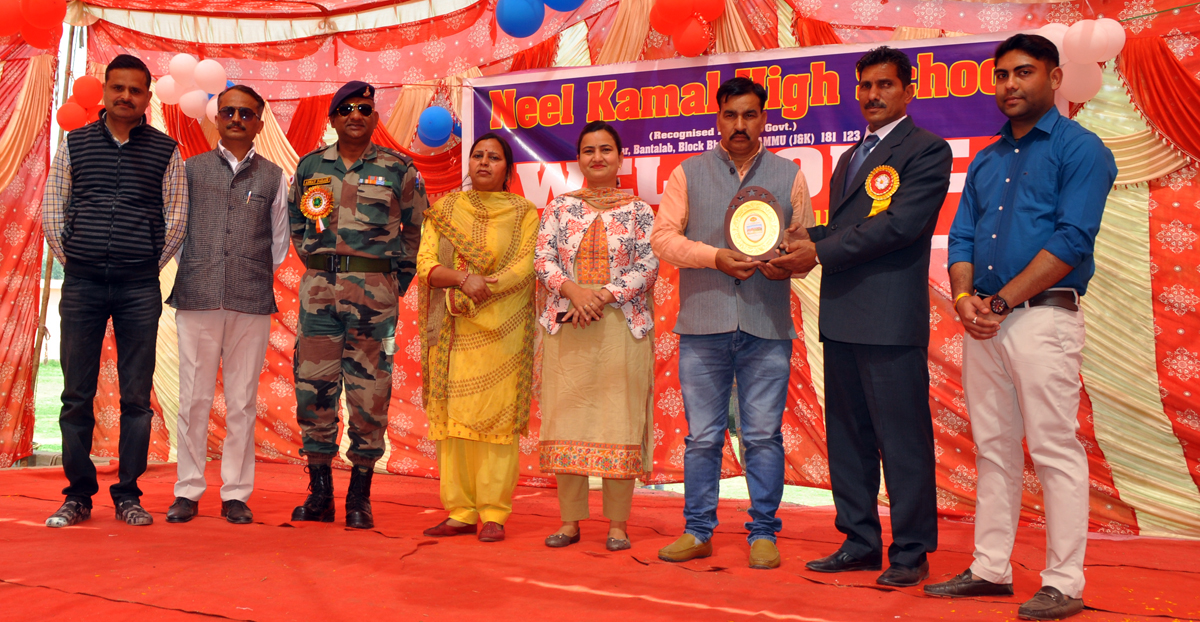 Memento presentation during Annual Day celebration at Neel Kamal School in Jammu. Memento presentation during Annual Day celebration at Neel Kamal School in Jammu.