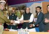 Union Home Minister, Rajnath Singh being greeted by the DG, CRPF, Rajeev Rai Bhatnagar with a sapling, at the inauguration and foundation stone laying ceremony of various residential and office buildings of CAPFs, CPOs and Delhi Police, in New Delhi on Wednesday.