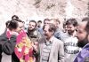 Sajad Lone meeting people during election campaign on Wednesday.