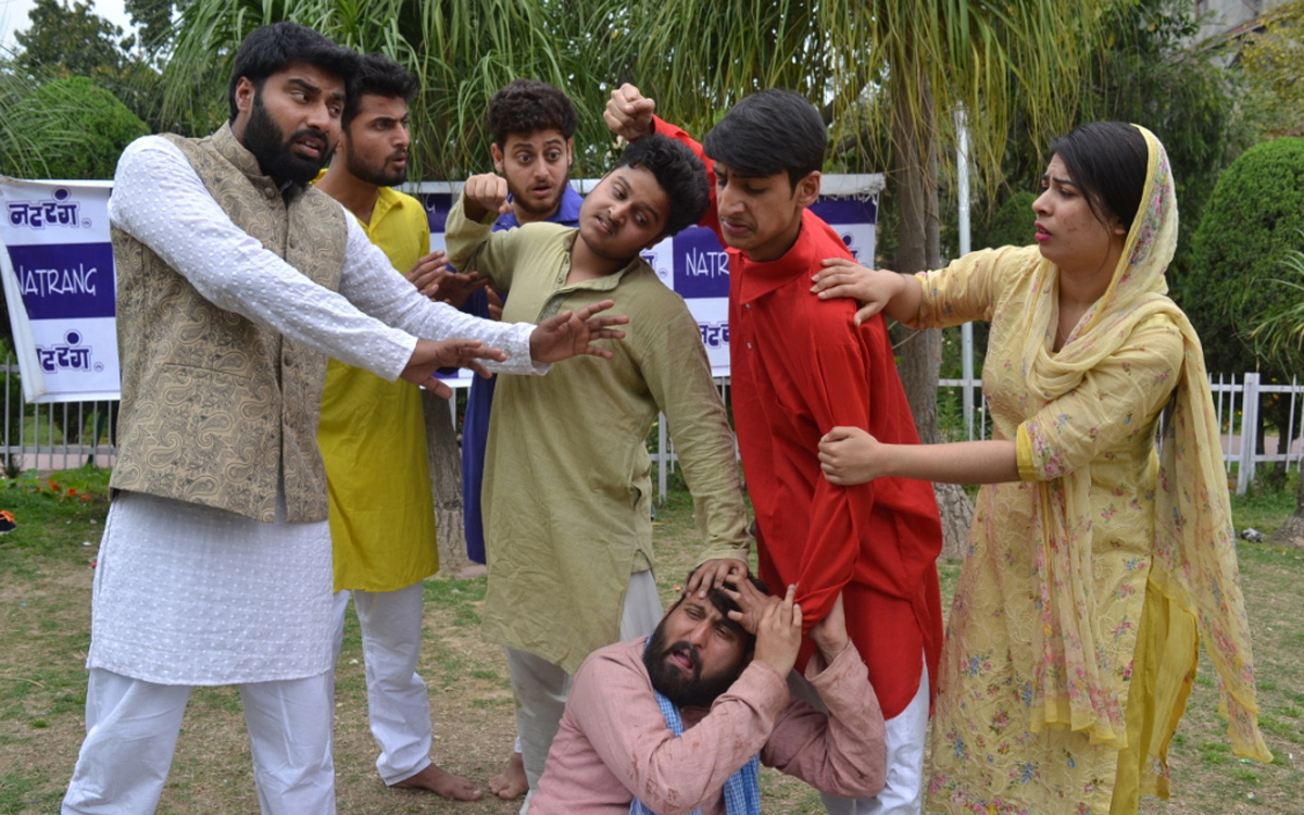 A scene from Hindi play 'AAG' staged at Jammu on Sunday. A scene from Hindi play 'AAG' staged at Jammu on Sunday.