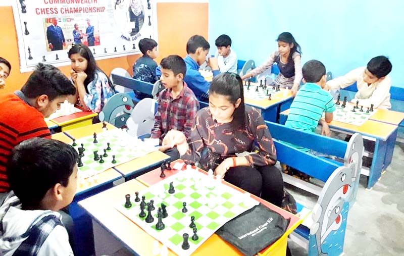 sing song (22) Players in action during Kathua District Chess Championship on Saturday.