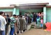 People wait for their turn to cast votes in Sonawar area of Bandipora district. -Excelsior/Aabid Nabi
