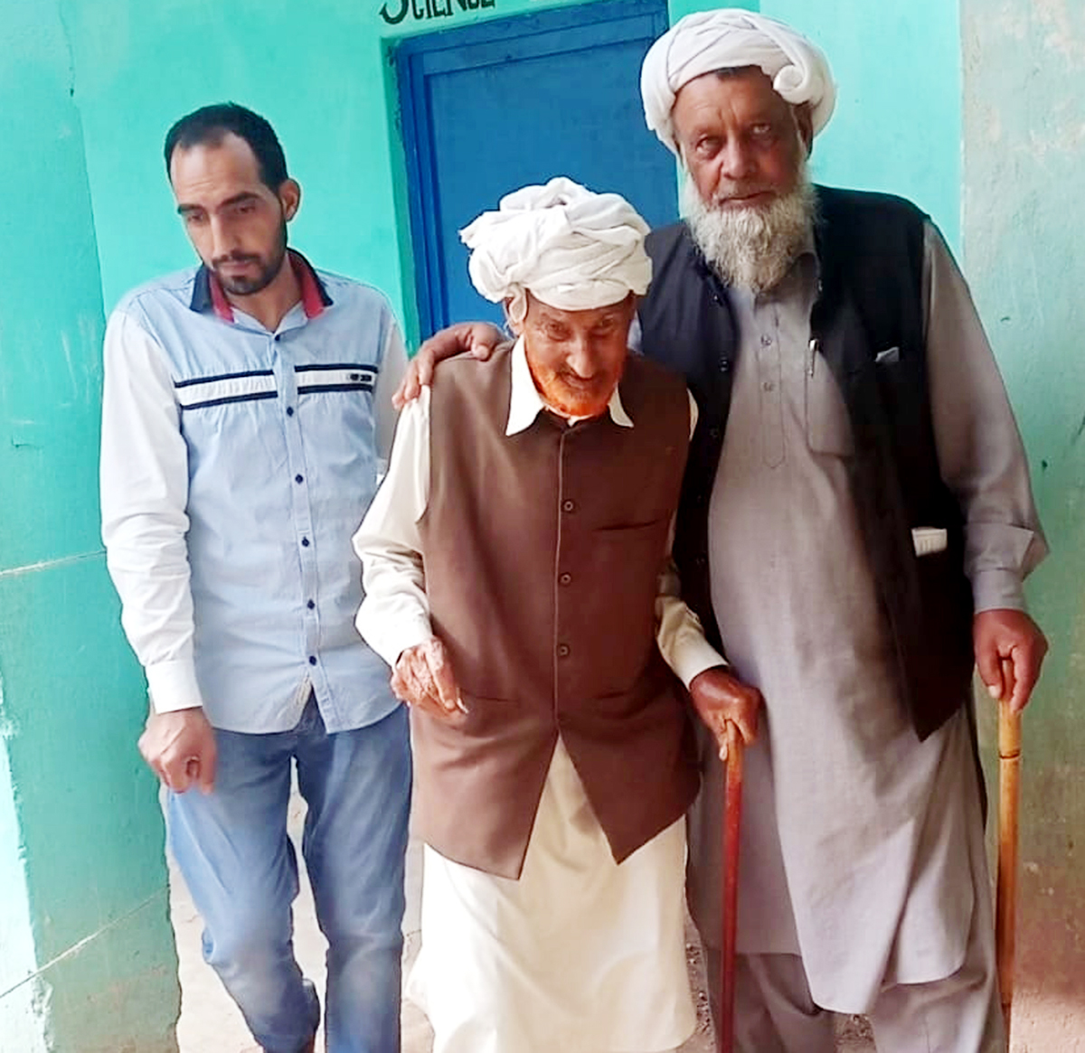 An elder being assisted by another to cast vote at a polling station on Thursday. -Excelsior/Rahi Kapoor An elder being assisted by another to cast vote at a polling station on Thursday. -Excelsior/Rahi Kapoor