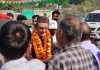 Dr Karan Singh interacting with people during election campaigning in Kathua district on Monday.