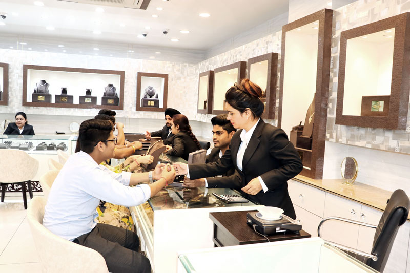 Customers selecting items at ‘Zevar’ jewellery showroom in Gandhi Nagar. Customers selecting items at ‘Zevar’ jewellery showroom in Gandhi Nagar.