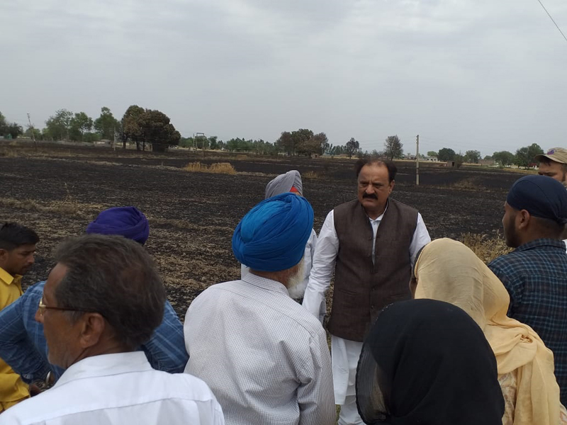 Senior NC leader, SS Slathia interacting with farmers whose crop was burnt at border village Nanga in Ramgarh. Senior NC leader, SS Slathia interacting with farmers whose crop was burnt at border village Nanga in Ramgarh.
