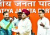 Union Minister and BJP leader Prakash Javadekar presents the membership slip to Gurjar leader Kirori Singh Bainsla, as he joins BJP, ahead of Lok Sabha polls, in New Delhi.